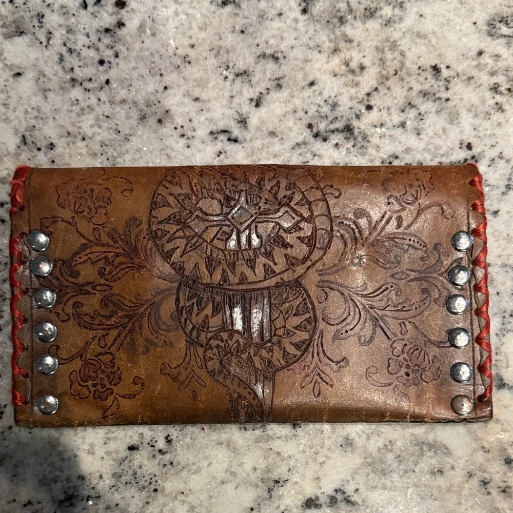 Brown hand tooled leather wallet